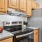 stainless steel appliances, granite countertops and wood cabinetry
