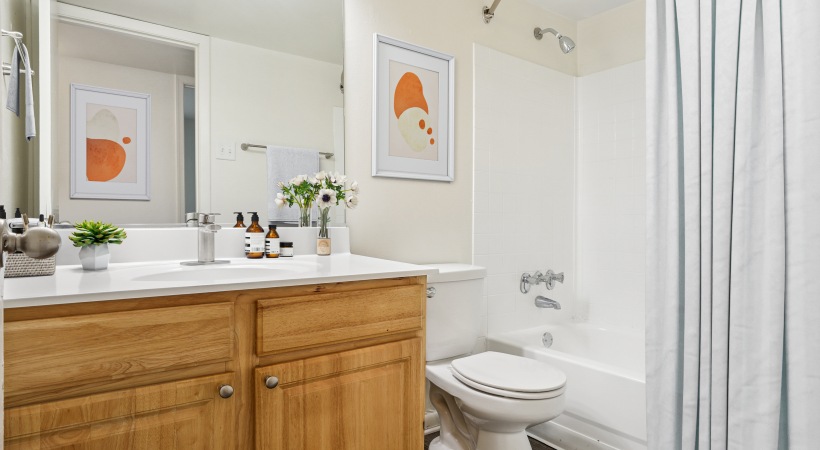 Renovated bathroom with upgraded lighting and countertops