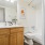 Renovated bathroom with upgraded lighting and countertops
